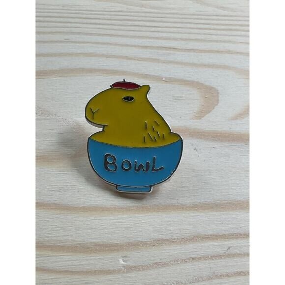 Capybara Enamel Pin With Text "Bowl" In Yellow & Blue Colors - Picture 1 of 3